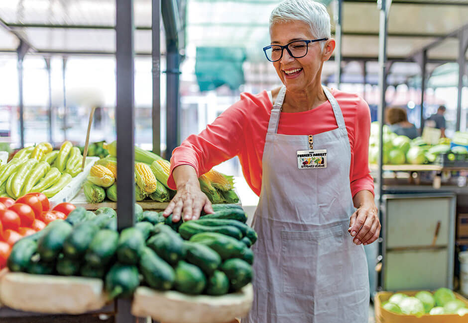 Grocer wearing plastic name badge