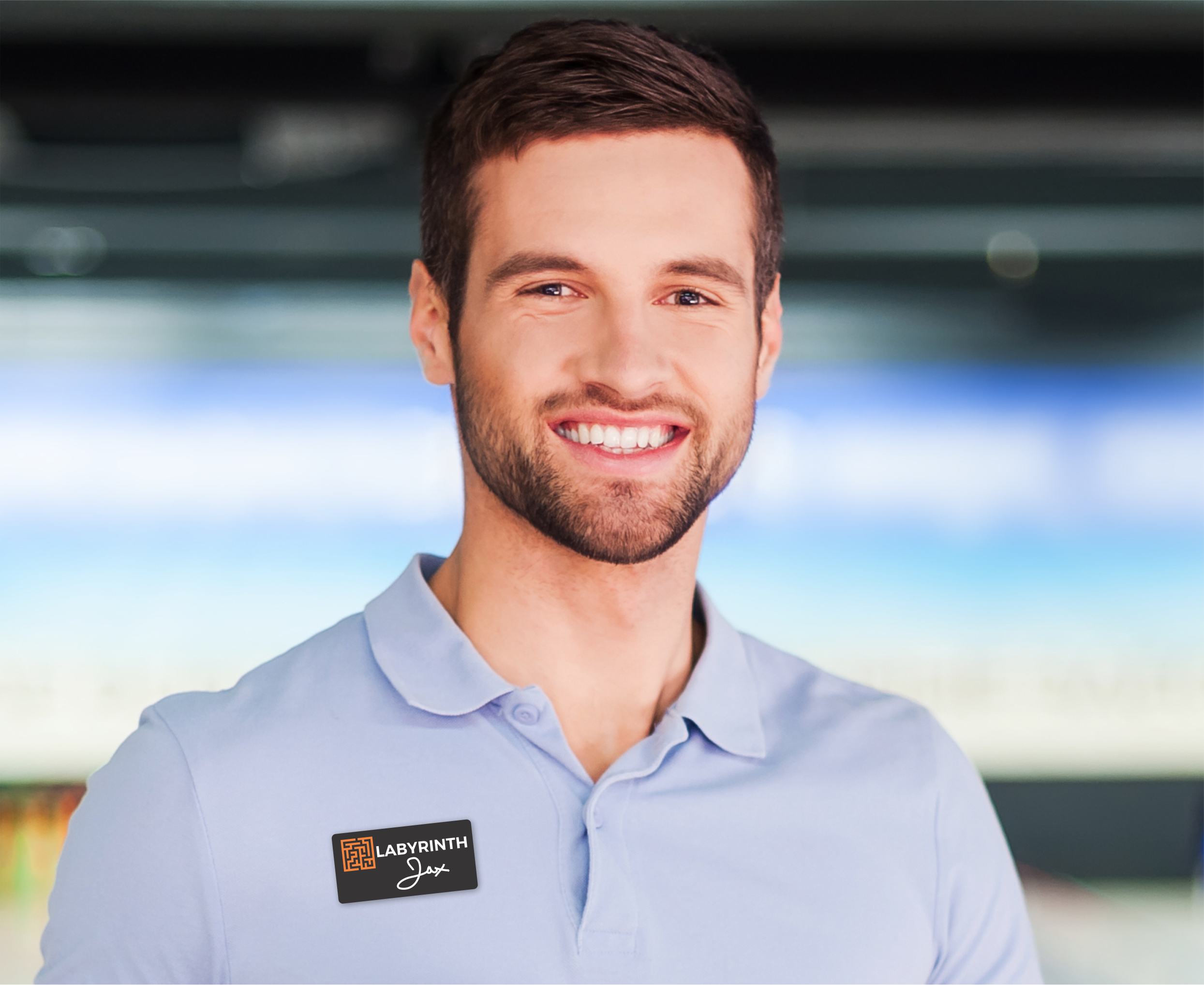 A man wearing a chalkboard name tag