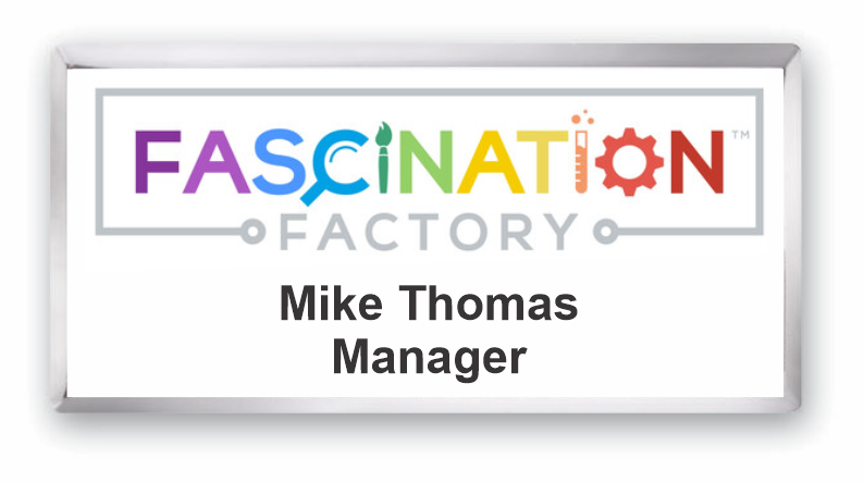 A silver and white metal rectangle name tag